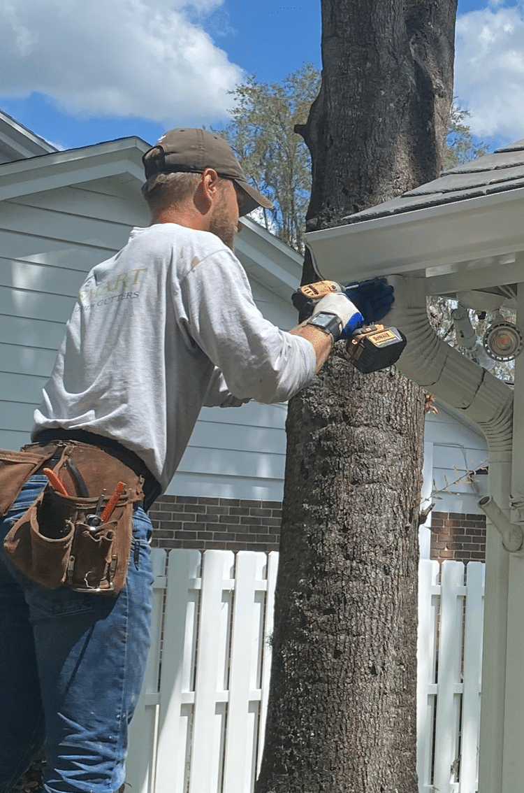 person installing gutters